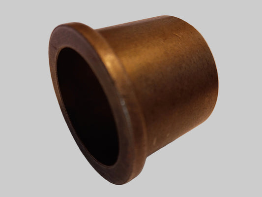 Bronze bushing on a beige textured surface