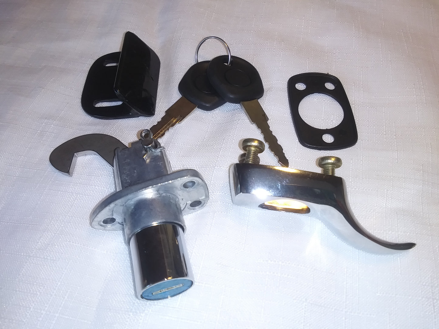Chrome trunk lock with longer hook and latch plate, two keys and gasket.
