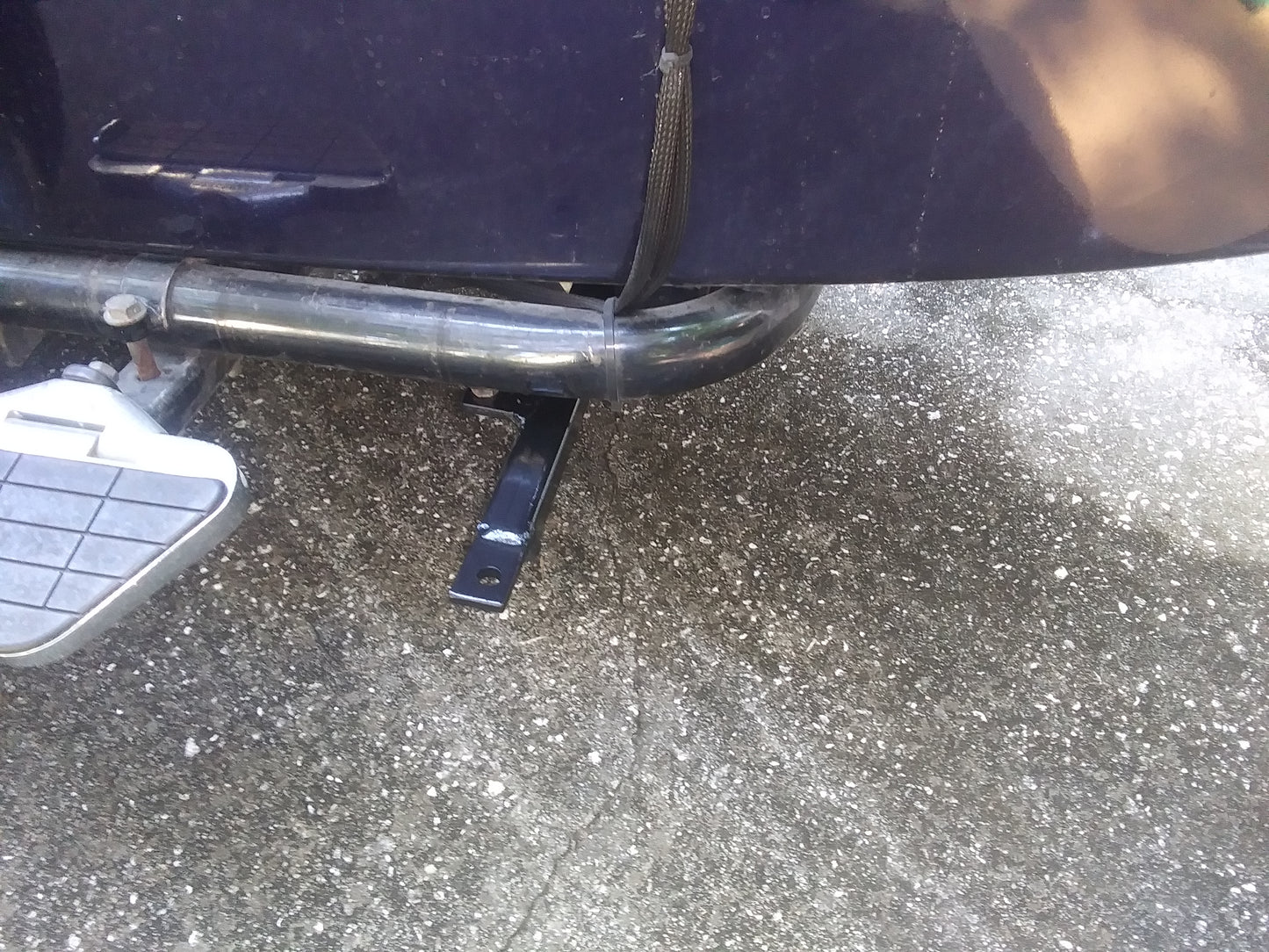 Metal bumper on a vehicle with a step stool nearby
