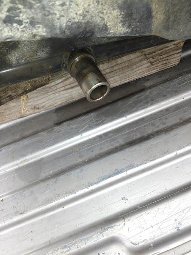 Metal pipe fitting on a metal surface