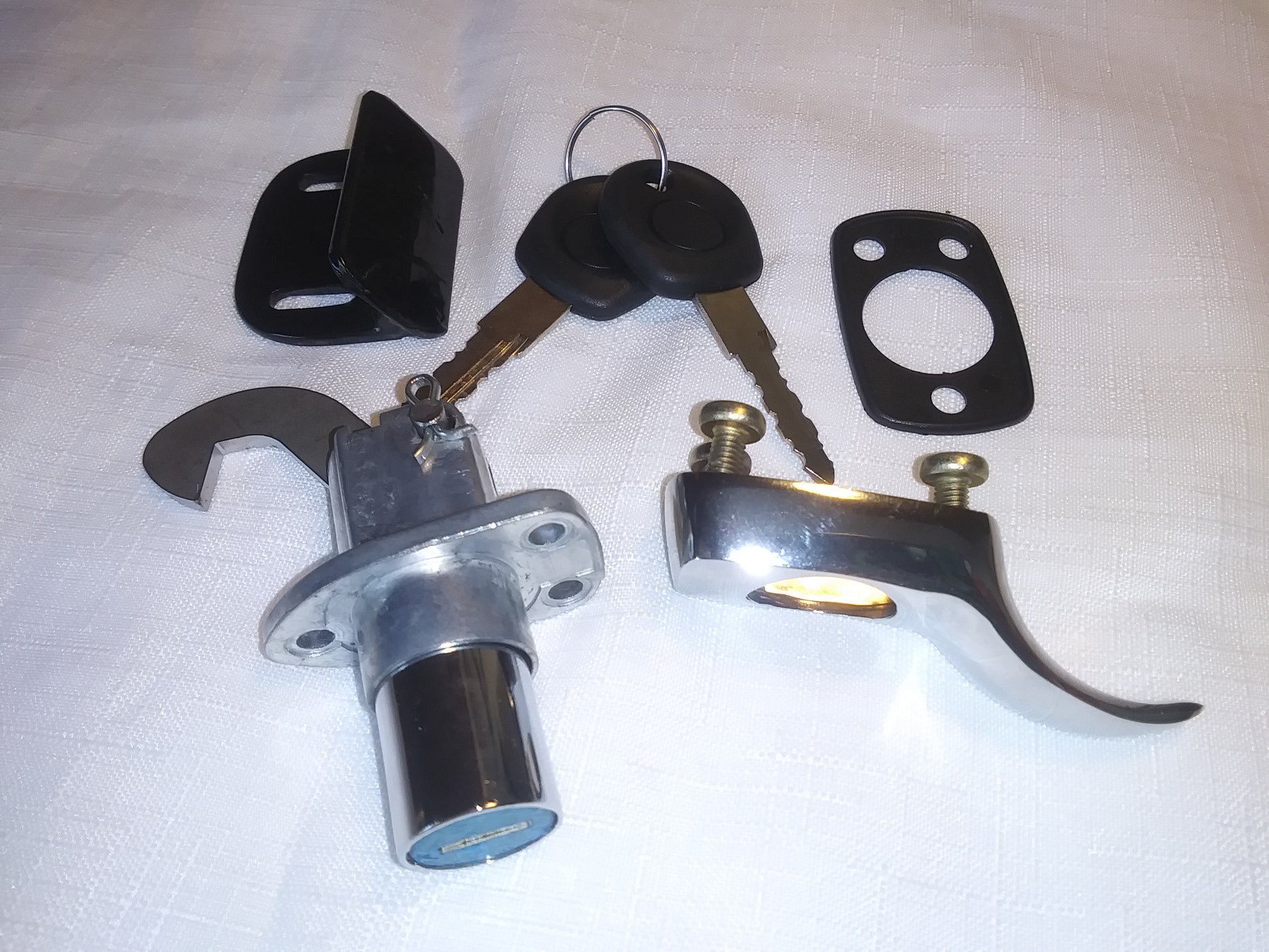 Chrome trunk lock with longer hook and latch plate, two keys  and gasket. 