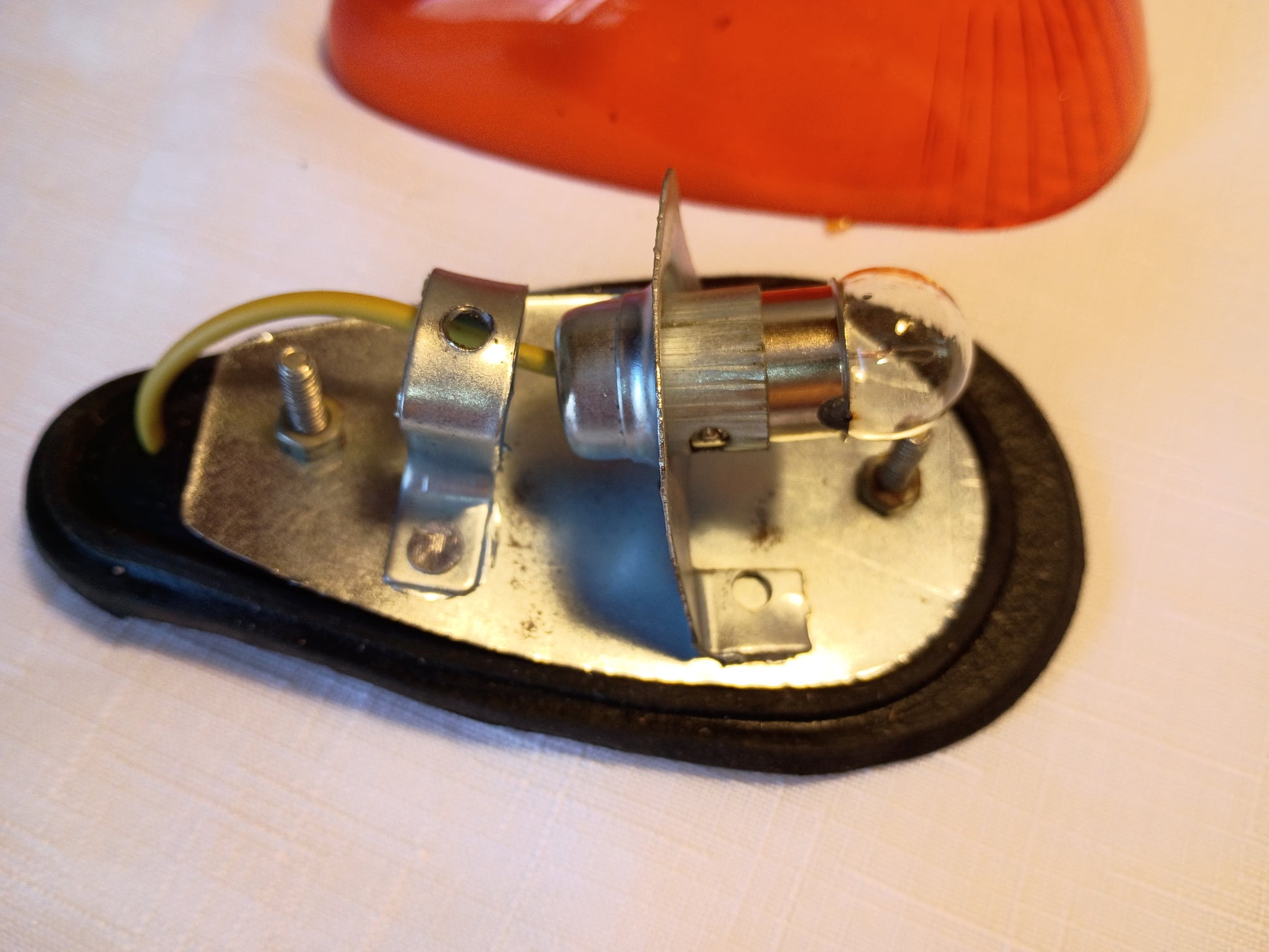 Mechanical component with a bulb on a white background