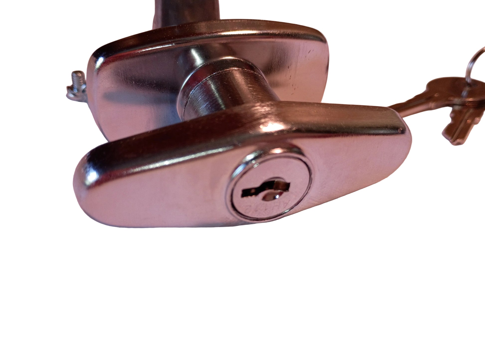 A close-up of a polished chrome security lock cylinder with a key inserted, resting on a light-colored textured fabric surface.