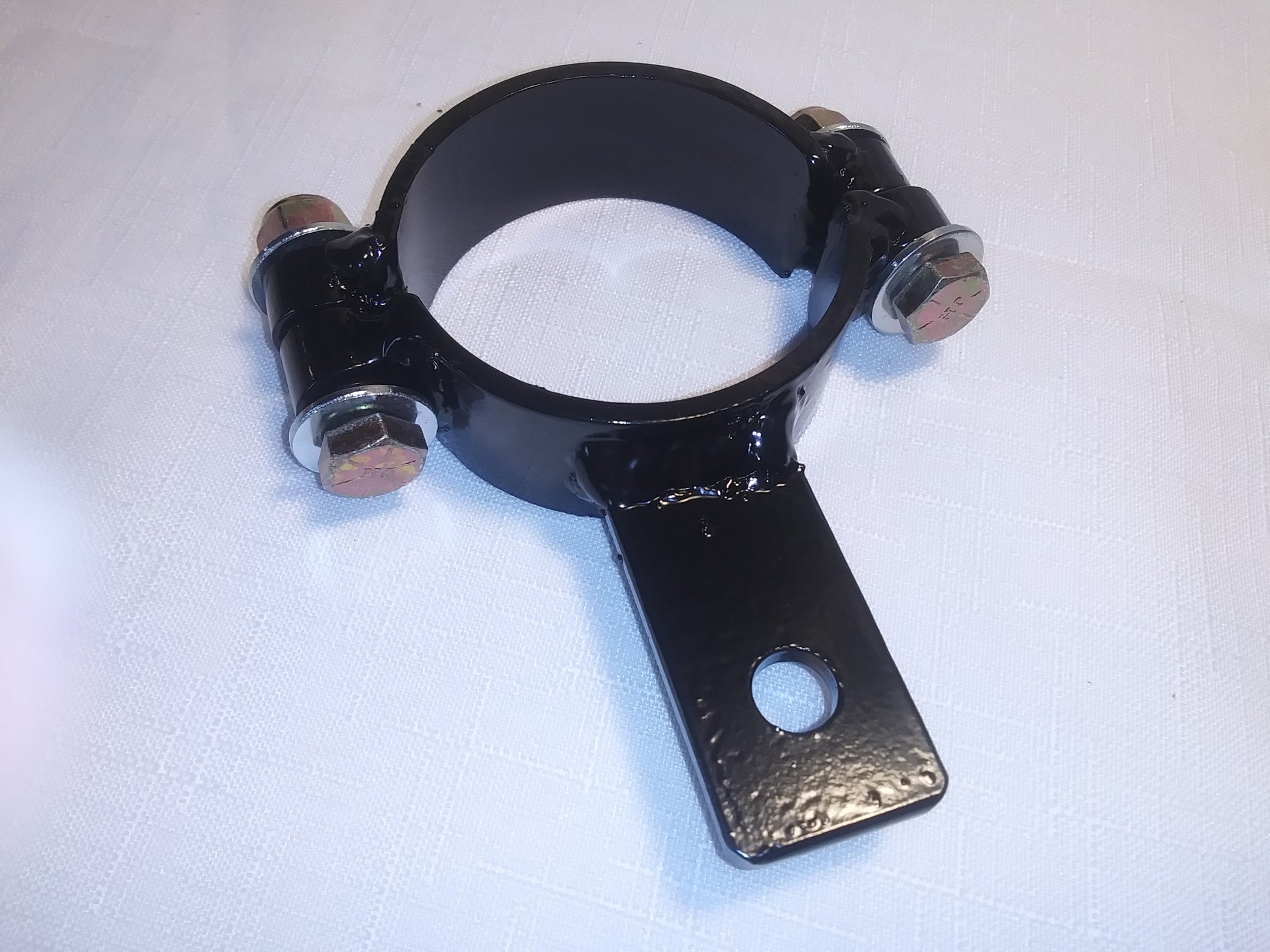Fork clamp to attach steering damper to Harley Davidson touring models with 41mm forks.
